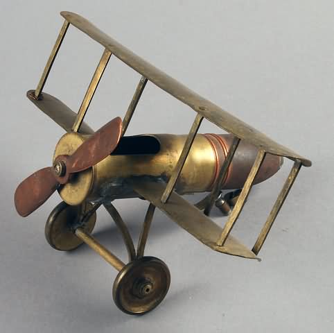 Appraisal: WWI Trench Art Biplane made from and mm shells tail