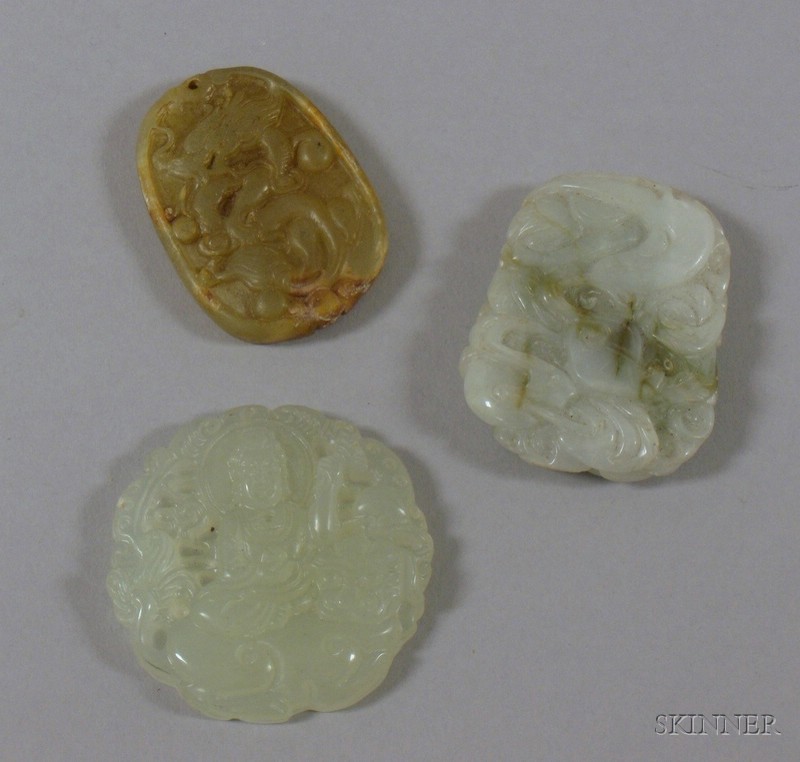 Appraisal: Three Asian Carved Jade Pendants depicting a seated Buddha a