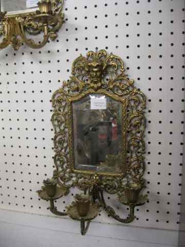 Appraisal: Pair of Bradley Hubbard Sconces bronzed god at top rococo