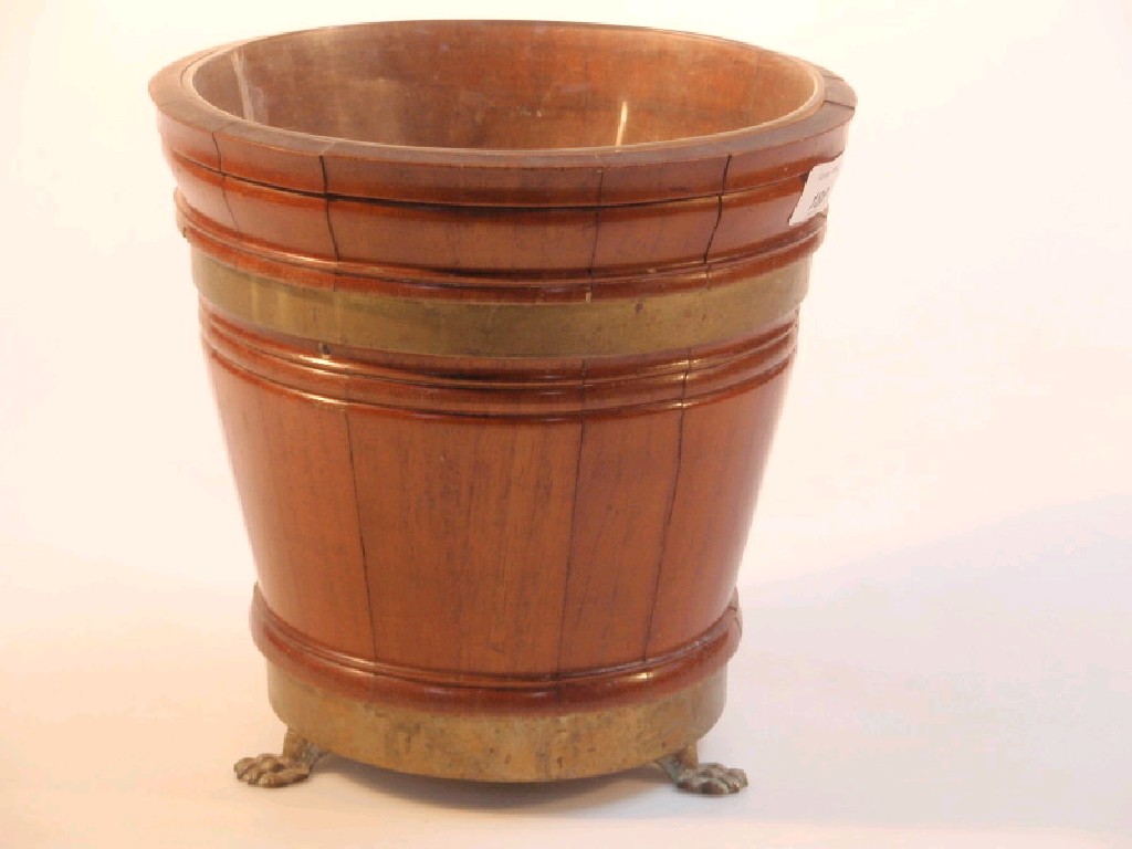 Appraisal: A mahogany brass bound planter on claw feet cm diameter