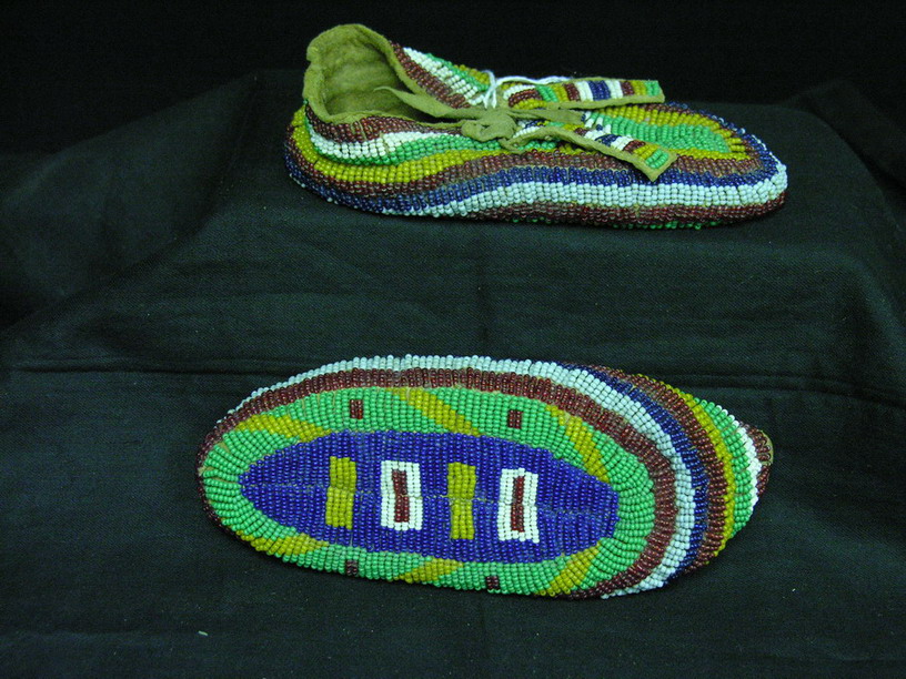 Appraisal: NATIVE AMERICAN CHILDS BEADED CEREMONIAL MOCCASINS Hand sewn on brain