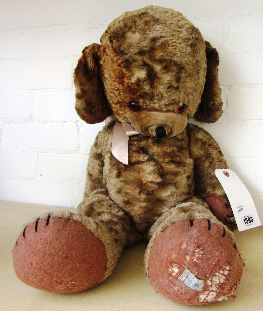 Appraisal: A Merrythought 'Cheeky' bear circa with orange glass eyes and