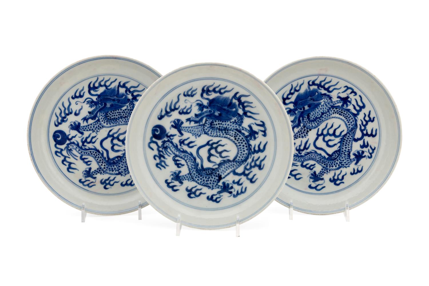 Appraisal: THREE CHINESE BLUE AND WHITE DRAGON PLATES Three Chinese blue