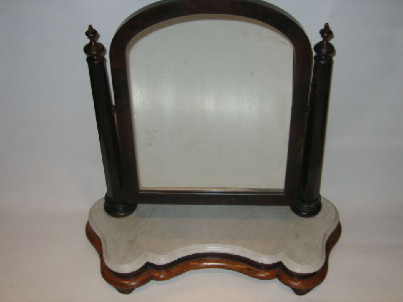 Appraisal: ENGLISH VICTORIAN MAHOGANY TOILET MIRROR The arched rectangular looking glass