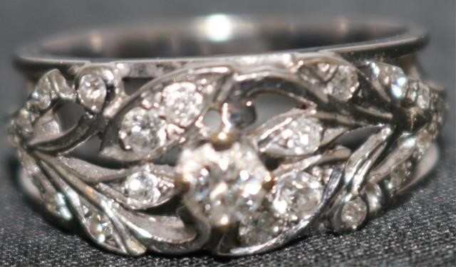 Appraisal: KT WHITE GOLD AND DIAMOND RING WITH CTCENTER STONE INSET