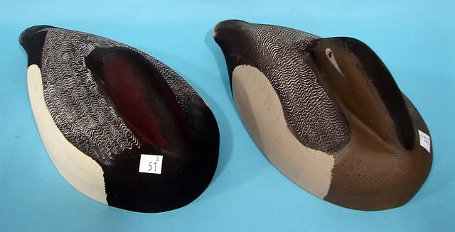 Appraisal: Pair of flat bottom sleeping Canvasback decoys marked TM on