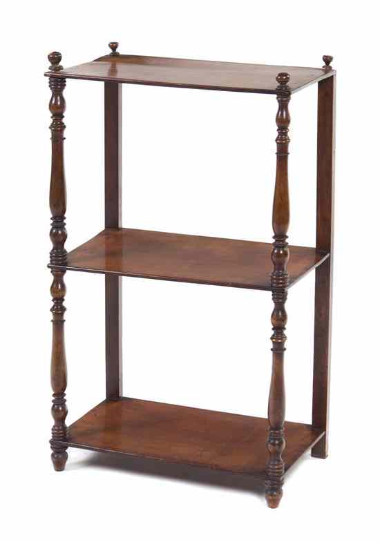 Appraisal: An English Mahogany Whatnot Shelf having turned finials over turned