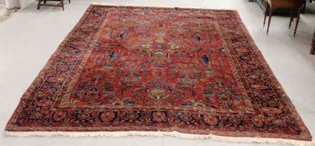 Appraisal: Room size Sarouk oriental carpet with a red field '