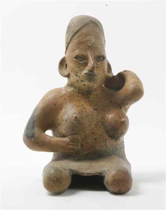 Appraisal: A Jalisco Style Pottery Figure depicting a seated woman holding