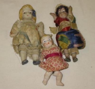 Appraisal: Three all bisque dolls house dolls with moulded painted faces