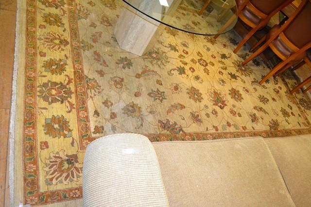 Appraisal: A LARGE PERSIAN HAND WOVEN RUG IN FADED YELLOW AND