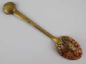 Appraisal: An unusual spoon with natural leopard cowrie shell bowl attached