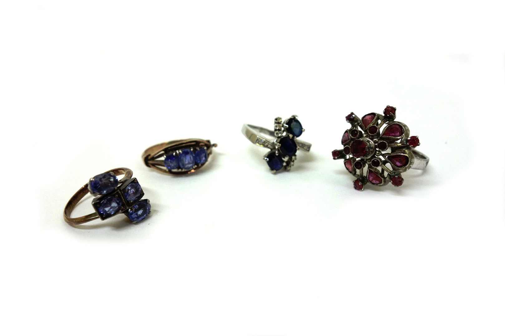 Appraisal: A sapphire and diamond ring with three oval mixed-cut sapphires