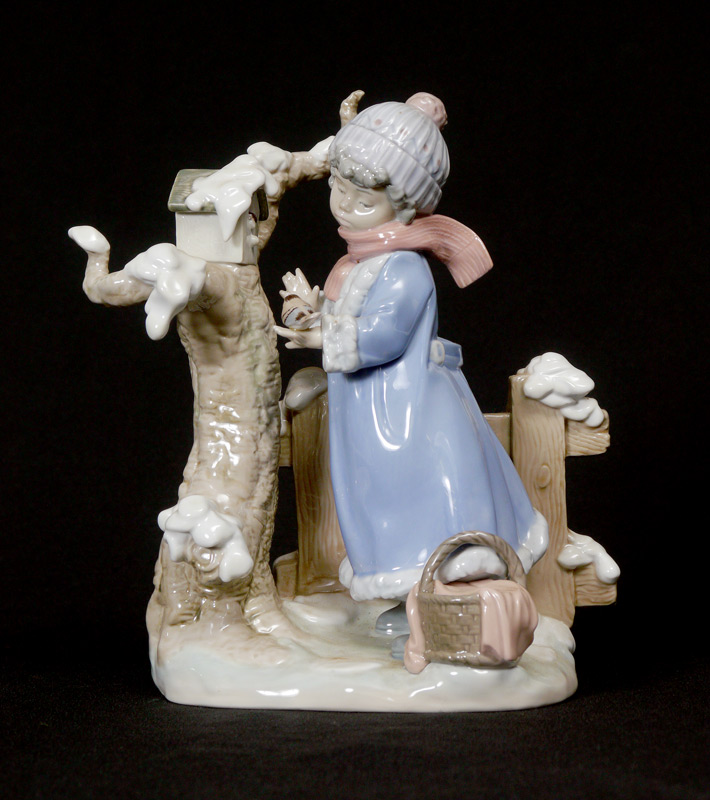 Appraisal: LLADRO PORCELAIN FIGURINE WINTER FROST little girl with birds at