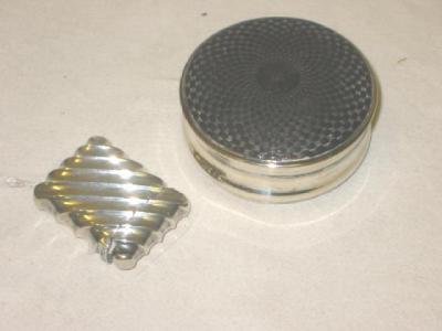 Appraisal: A WHITE METAL SNUFF BOX of circular form with engine