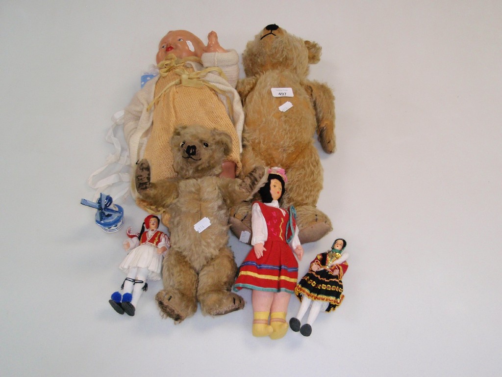 Appraisal: Two early th century teddy bears a celluloid doll and