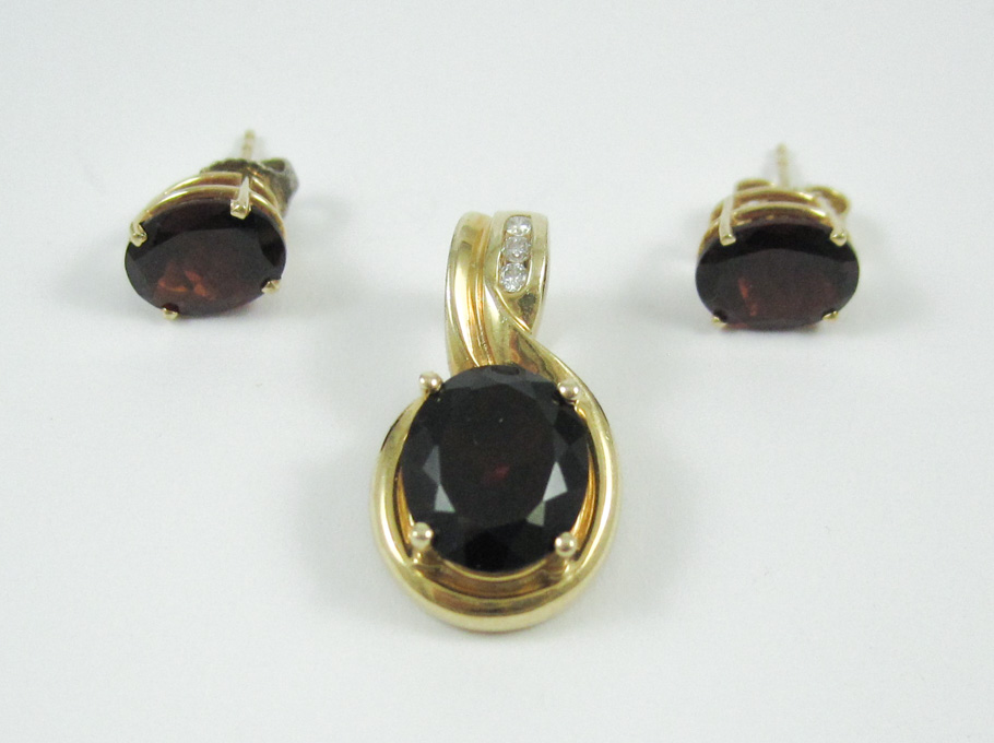 Appraisal: THREE ARTICLES OF GARNET JEWELRY including a k yellow gold