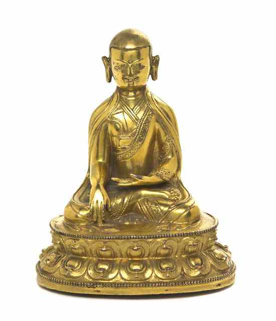 Appraisal: A Gilt Bronze Model of a Buddhist Figure depicted with