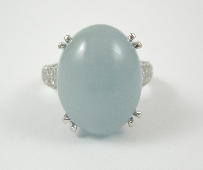 Appraisal: AQUAMARINE AND FOURTEEN KARAT WHITE GOLD RING with round-cut diamonds