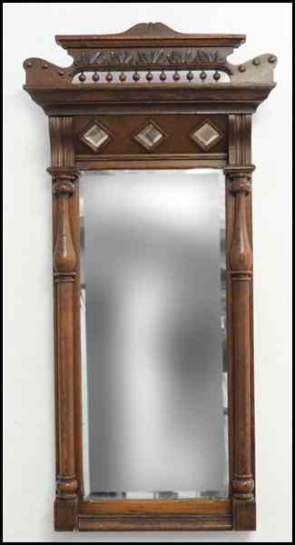 Appraisal: EASTLAKE STYLE CARVED WALNUT MIRROR H '' W '' D