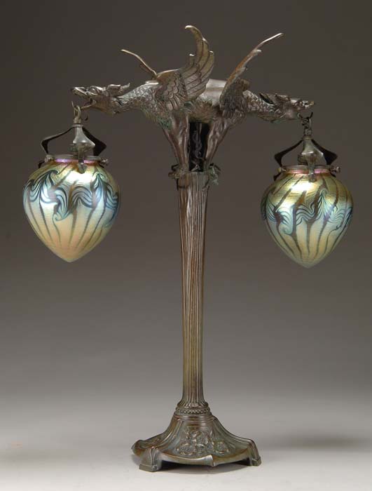 Appraisal: LOETZ FIGURAL LAMP Spectacular Loetz lamp has cast bronze base