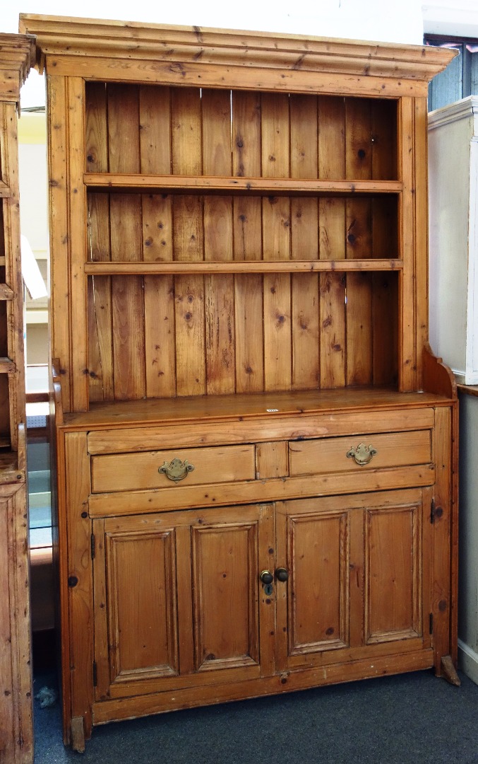 Appraisal: A th century and later Irish pine dresser the enclosed