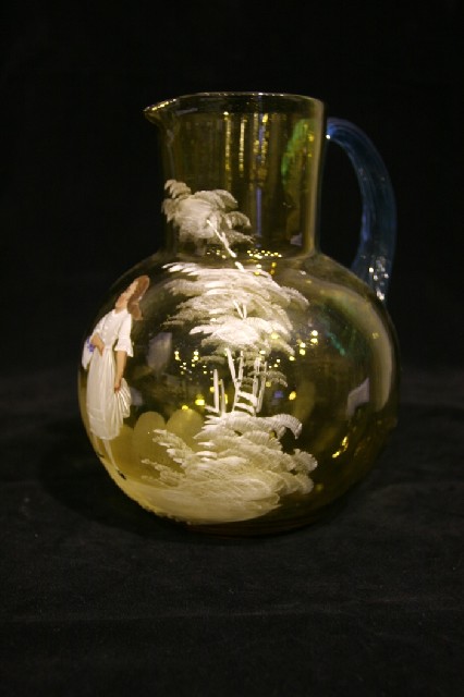 Appraisal: A hand blown amber glass jug in the manner of