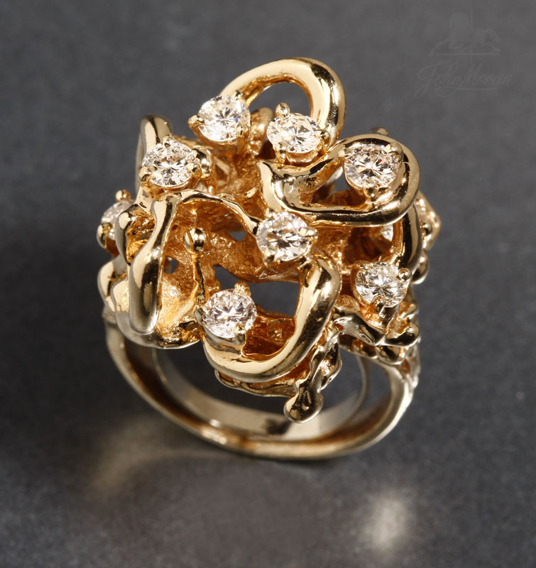 Appraisal: A gold and diamond free-form ring A gold and diamond