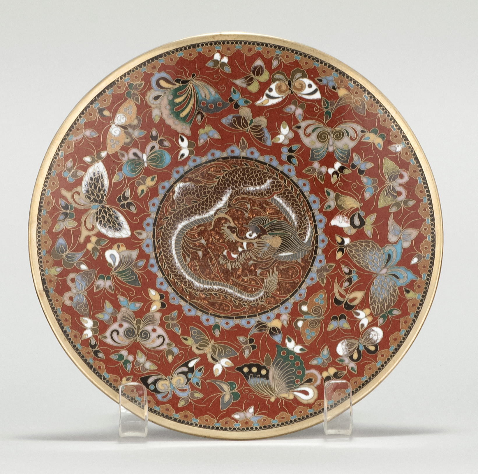 Appraisal: CLOISONN ENAMEL DISH Meiji PeriodIntricate butterfly decoration around a central