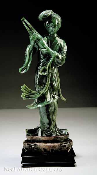 Appraisal: A Chinese Carved Spinach Jade Figure of an Immortal late