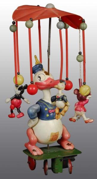 Appraisal: Celluloid Walt Disney Donald Duck Carousel Toy Description Japanese Pre-war