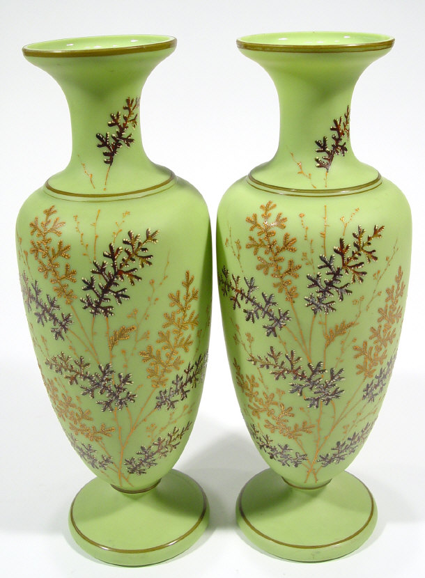 Appraisal: Pair of Victorian green glass vases hand enamelled with leaves