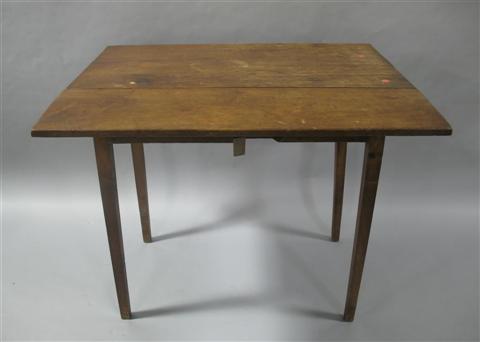 Appraisal: HEPPLEWHITE WALNUT DROPLEAF TABLE th century the rectangular top flanked