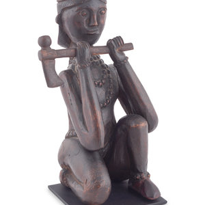 Appraisal: A Seated Folk Art Carved Walnut Indian with Tomahawk Late