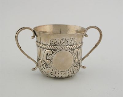 Appraisal: A Queen Anne porringer two s-scroll handles and a flared