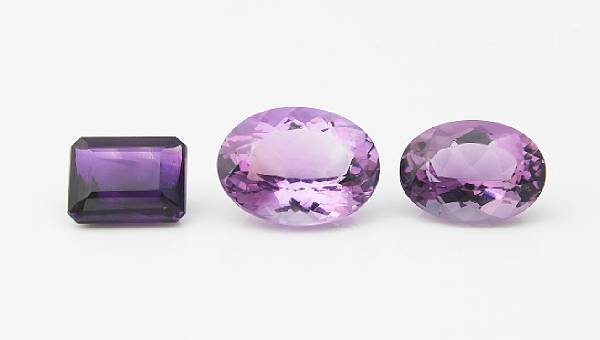 Appraisal: Group of Three Amethysts Three unmounted stones including an oval-cut