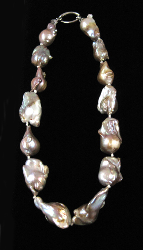 Appraisal: PRINCESS LENGTH PINK PEARL NECKLACE strung with large baroque pink