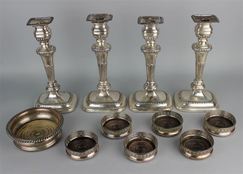 Appraisal: SET OF FOUR SHEFFIELD PLATE CANDLESTICKS AND SEVEN COASTERS the