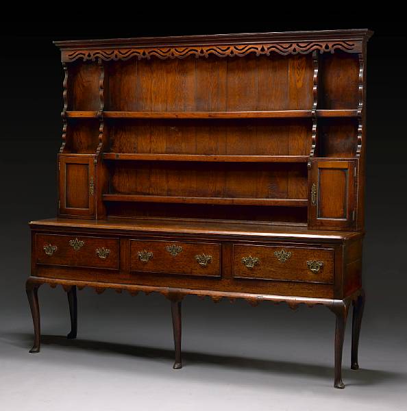 Appraisal: A George III oak high dresser base second half th