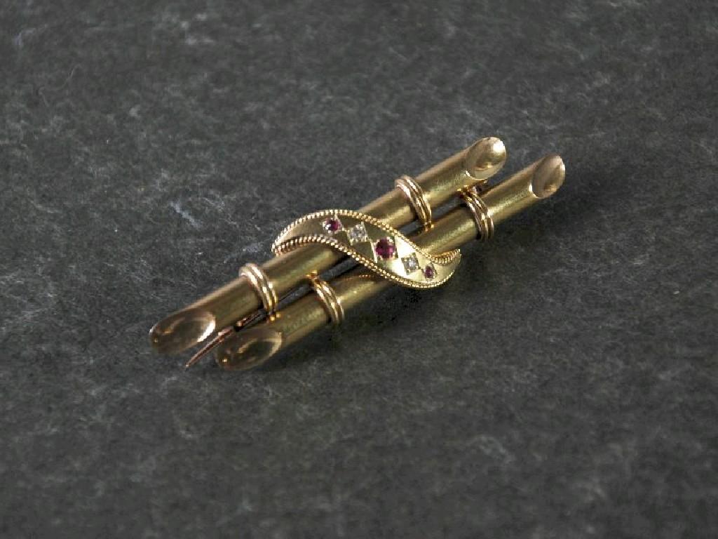 Appraisal: EDWARDIAN ct GOLD TINY RUBY AND DIAMOND CHIP SET BROOCH