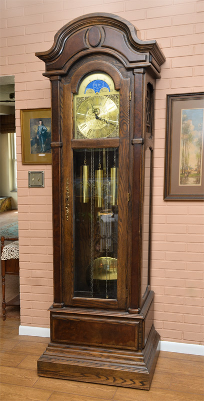 Appraisal: ZACHARIAH OAK GRANDFATHER CLOCK Arched pediment with applied burl accents