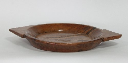 Appraisal: An Indian softwood platter with triangular handle cut from one