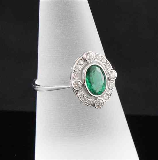 Appraisal: An ct white gold emerald and diamond oval dress ring