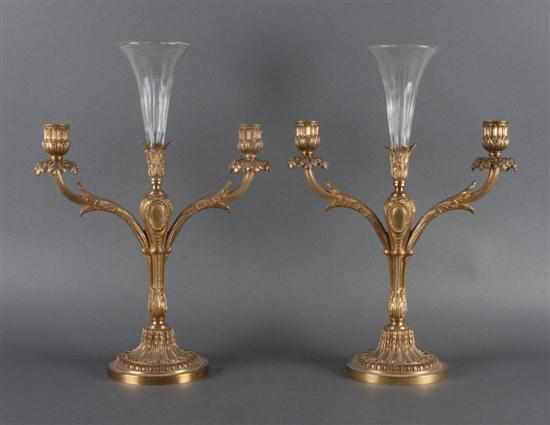 Appraisal: Pair of rococo style weighted brass candelabra vases Estimate -