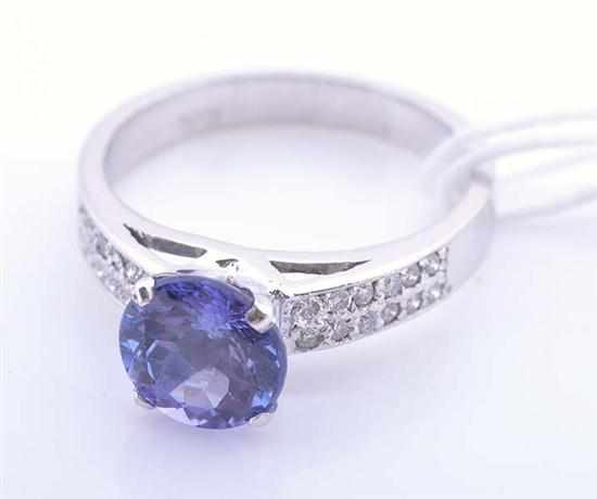 Appraisal: A TANZANITE AND DIAMOND DRESS RING IN CT WHITE GOLD