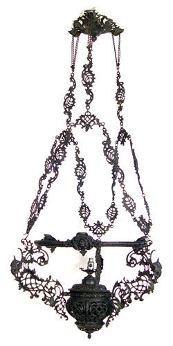 Appraisal: ORNATE VICTORIAN IRON CHANDELIER Intricate chain supports with masquerons and