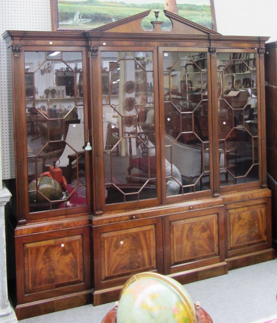 Appraisal: A mid th century design mahogany breakfront four section bookcase