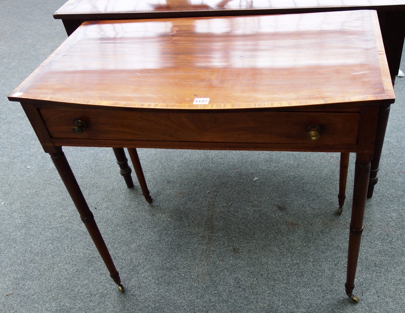 Appraisal: A th century tulip wood banded mahogany bowfront single drawer