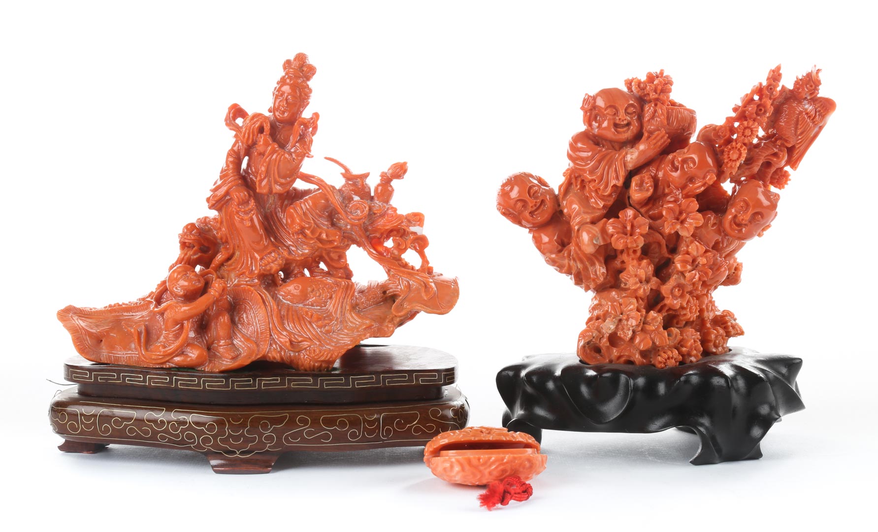 Appraisal: Two Chinese carved coral figural groups first group depicting four