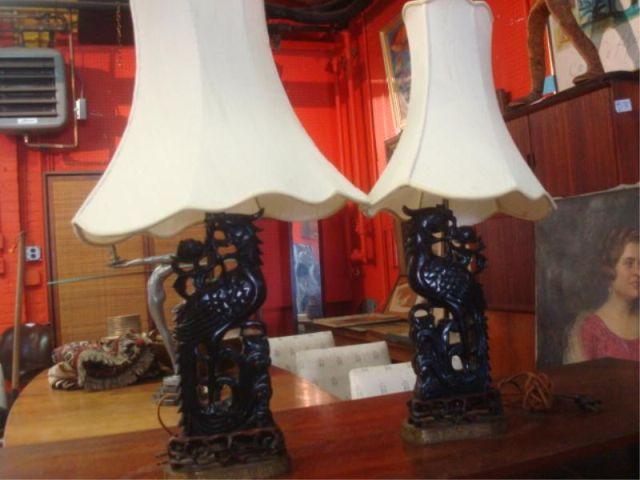 Appraisal: Pair of Black Amber Carved Asian Lamps on Metal Bases